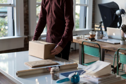 man unboxing a package with box fillers